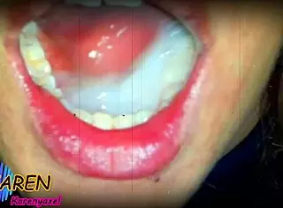 Karen teases with huge cumshot in mouth and jizz on tongue in slow motion.