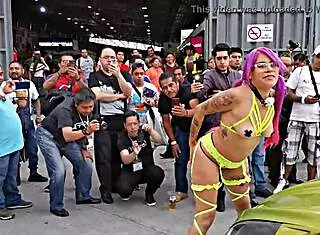 Prostitute with pigtails in sailor outfit parades her ass outdoors at Mexican auto expo showing pussy by Hyperversos.