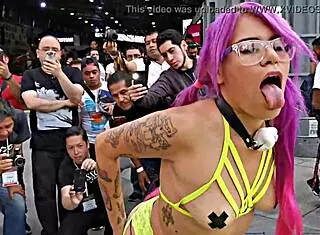 Prostitute with pigtails in sailor outfit parades her ass outdoors at Mexican auto expo showing pussy by Hyperversos.