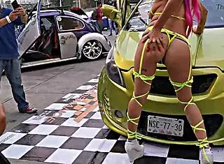 Prostitute with pigtails in sailor outfit parades her ass outdoors at Mexican auto expo showing pussy by Hyperversos.