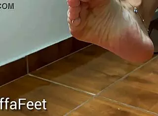 French goddess Kiffa teases with dangling Havaianas flip flops. She shows off foot fetish details like anklets and toe rings in shoe play.