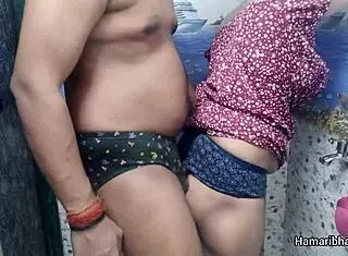 this indian desi bhabhi casually gives her husband an intense handjob in the bathroom, making him cum hard on her sexy blue panties