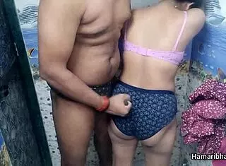 this indian desi bhabhi casually gives her husband an intense handjob in the bathroom, making him cum hard on her sexy blue panties