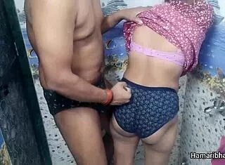 this indian desi bhabhi casually gives her husband an intense handjob in the bathroom, making him cum hard on her sexy blue panties