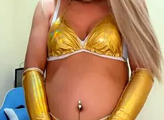 Sexy transsexual in pink pajamas teases with alluring poses and seductive moves in close-up shots