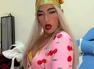 Sexy transsexual in pink pajamas teases with alluring poses and seductive moves in close-up shots