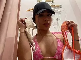 Hey, check out this hot slut caught trying on a bikini with perfect tits and big ass