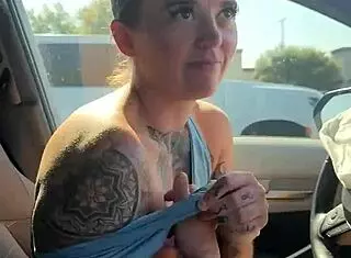 just a girl trying to adjust her sports bra properly in the gym parking lot