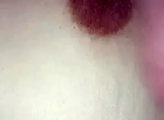 Gretala's toy cock on her breasts