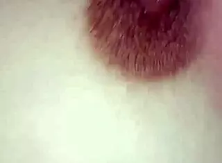 Gretala's toy cock on her breasts