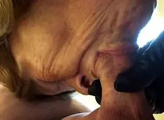 Hey, check out granny Peggy Sue sucking two cocks deep with a strapon twist