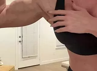 Amateur mature blonde babe flexes muscles in big tits milf solo