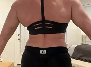 Amateur mature blonde babe flexes muscles in big tits milf solo