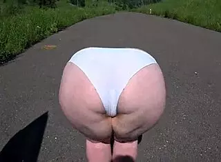 girlfriend uses strap-on to fuck milf with fat booty near car in outdoor lesbian pov action