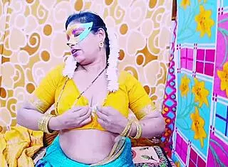 desi bhabhi casually shows off her big boobs and fingers wet pussy while chatting dirty in solo masturbation session on the bed