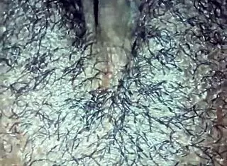 so this ebony chick starts playing with her wet hairy pussy at home. she rips clothes for solo orgasm in dripping beaver action.