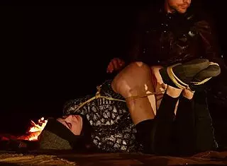 Genuine anal virgin gets tied up in the desert at night for rough training with fingers, paddling, and ass to mouth in this domination documentary - Brooke Johnson