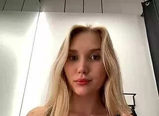 maria thull performs a captivating striptease, slowly undressing with clothes ripped in a blonde solo session