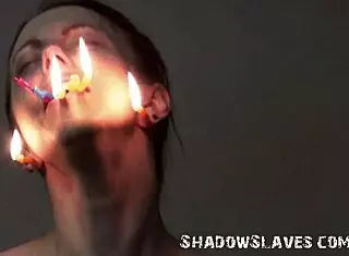 Emily T tied in garage as brutal master punishes slave with burning facial