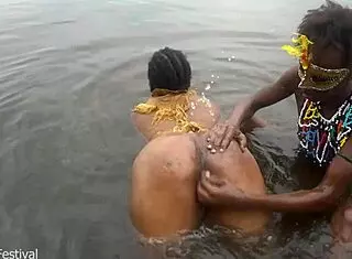 Two tribal lesbians share suggestive river bath