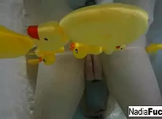 nadia bathes seductively with playful rubber duckies