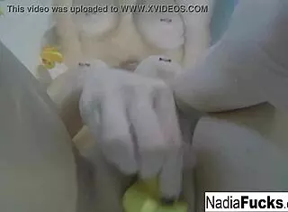 nadia bathes seductively with playful rubber duckies