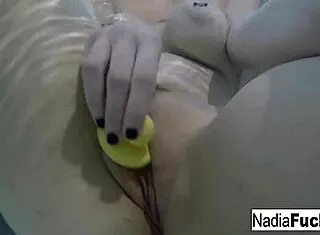 nadia bathes seductively with playful rubber duckies