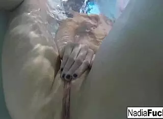 nadia bathes seductively with playful rubber duckies