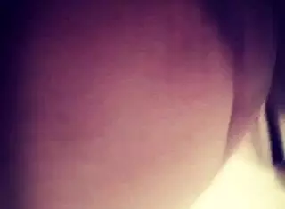Marlene teases her juicy tits and ass