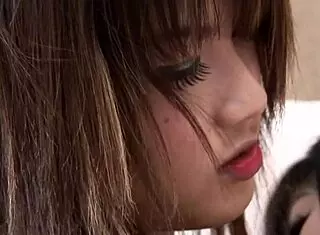 two asian babes explore each other's bodies with lesbian strapon play