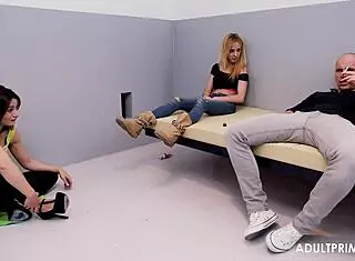 three prisoners whiling away hours together in dim cell block