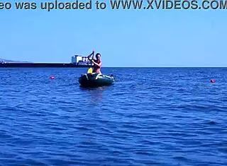 mature bikini babe poses erotically on boat in volga river water