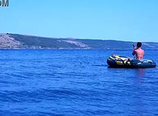 mature bikini babe poses erotically on boat in volga river water