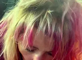 Pretty street hooker kneels in car backseat sucking cum into whore mouth.