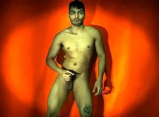 sexy solo guy strokes monster cock on orange backdrop