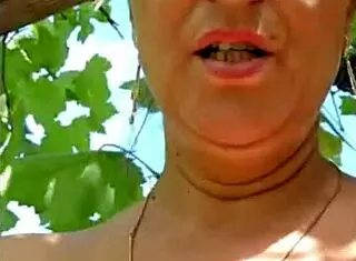 hairy milf flashes her natural tits outdoors like a tease