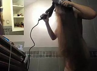 sexy brunette babe brushes her long hair showing off tits and ass