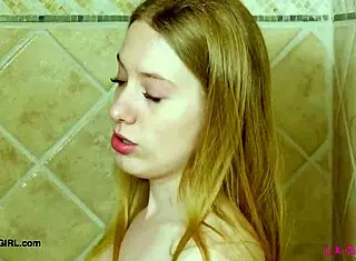 Bright-Eyed Blonde Enjoys Steamy Shower Moment