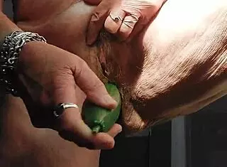 granny's hairy pussy pulses wildly on cucumber thrust