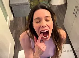 Brunette housewife swallows cum in mouth while adjusting rubber bands on braces