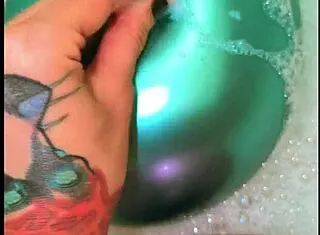 tattooed babe, those balloons make your bath so naughty huh?