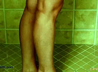 A captivating blonde model steps into the shower for a steamy reveal