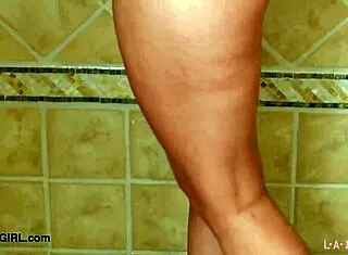 A captivating blonde model steps into the shower for a steamy reveal