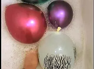 tattooed babe, those balloons make your bath so naughty huh?