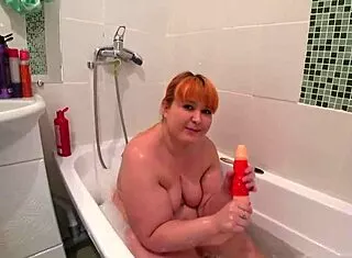 A Plump Redhead Milf Bathes with Toys Big Ass Shakes Doggystyle