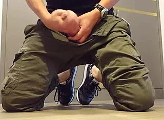 guy strokes cock hard while wearing sneakers