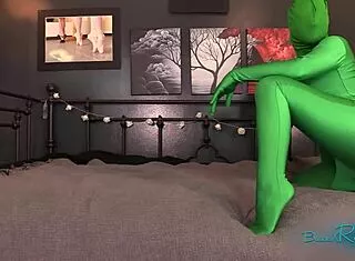 Hooded girl in green zentai