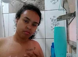 Hey, watch this hottie shower and flash her wet pussy!