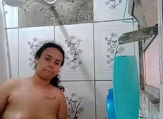Hey, watch this hottie shower and flash her wet pussy!