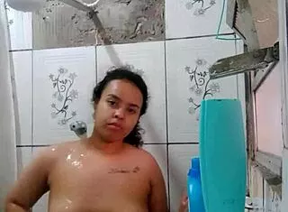 Hey, watch this hottie shower and flash her wet pussy!